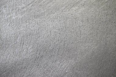 Duvardaki gri dokulu sıva kabartmalı. Duvardaki doku dikişsiz kaba