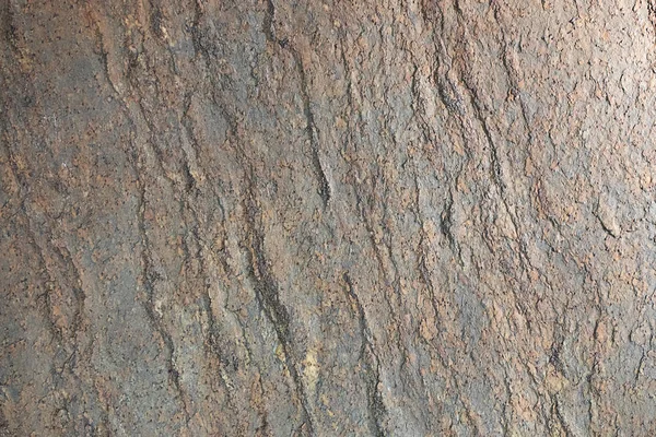 Piedra natural, textura oxidada en relieve. La pared está hecha de piedra, la superficie es de textura, rojo, color oxidado . — Foto de Stock