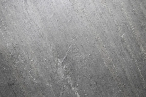 Piedra natural, textura en relieve gris. La pared está hecha de hormigón, la superficie está texturizada, gris . — Foto de Stock