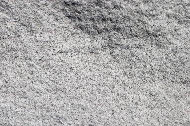 Doku doğal pürüzsüz taş. Gri renkli arka plan doğal taş. Siyah noktalar.