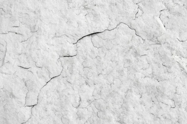 La texture de la pierre de granit blanc naturel avec des fissures. Fond de pierre naturelle gris. Texture avec une petite fissure . — Photo