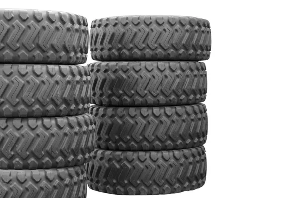 Grands pneus en caoutchouc pour camions couchés dans la rue. Beaucoup de pneus neufs — Photo