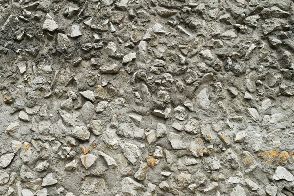 Fondo de guijarros textura con cemento. La textura es una gran piedra de color gris sobre una superficie plana . — Foto de Stock