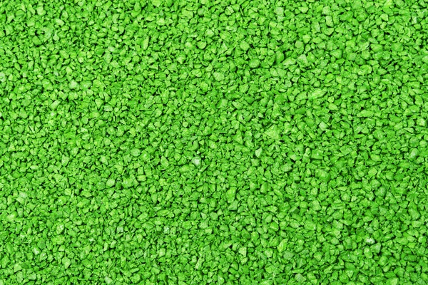 緑色のテクスチャの背景。遊び場のための芝生の表面や細かいテクスチャ。クローズアップテクスチャ. — ストック写真