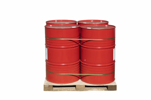 Four red barrels of 200 liters for liquid. Barrels stand on a pallet. Hazardous liquid in steel barrels. Isolated white background — Stock Photo, Image