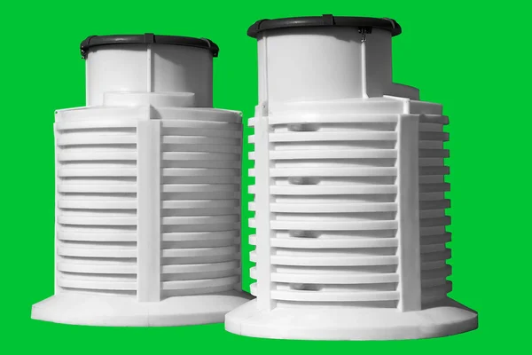 White plastic caisson for water from a well. Large white barrel with lid for septic tank. Isolated green background. — Stock Image White plastic caisson for water from a well. Large white barrel with lid for septic tank. Isolated green background. Royalty Free Stock Images