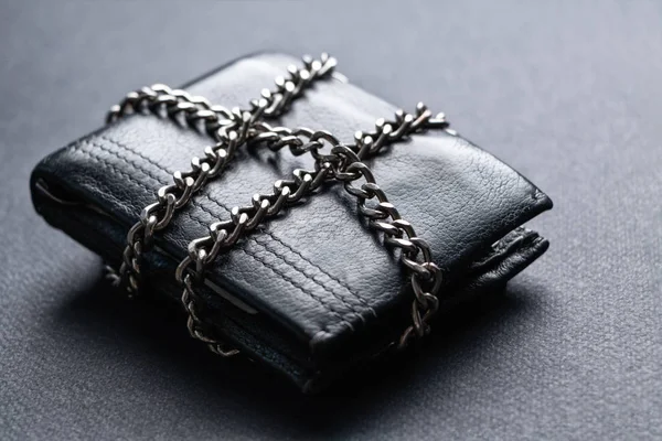 The concept of the wallet is locked with a chain.