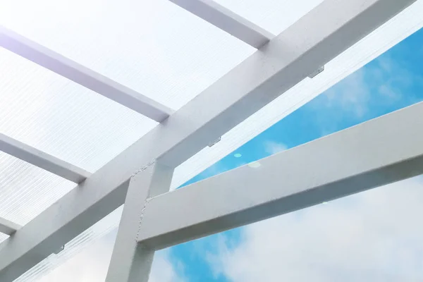 A canopy made of polycarbonate against the sky. glow toned.