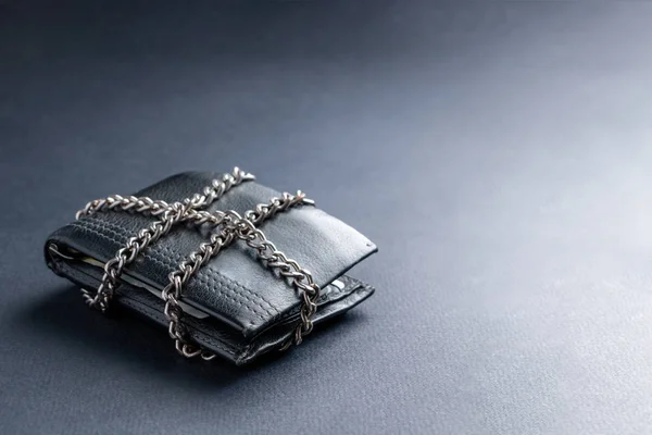 The concept of the wallet is locked with a chain.