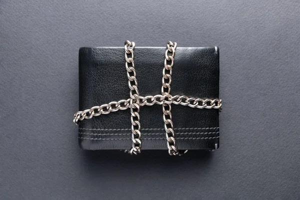 The concept of the wallet is locked with a chain.Top view.