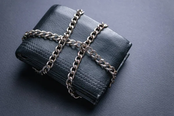 The concept of the wallet is locked with a chain
