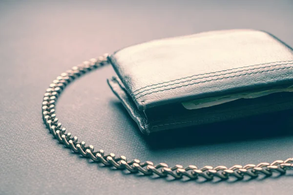 Concept. Near wallet chain free of restrictions or protection. Toned.