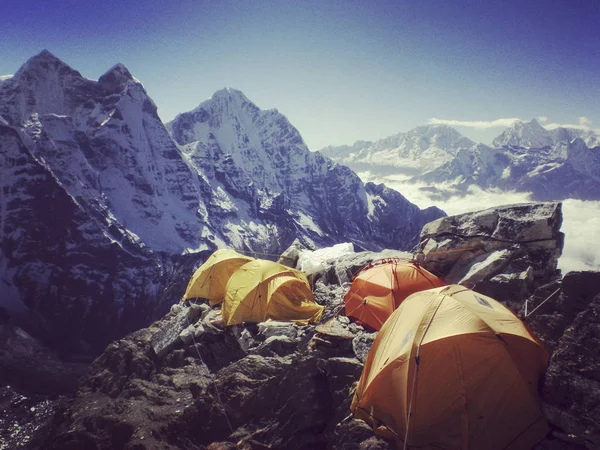 Camping near North Annapurna Base Camp overlooking Annapurna glacier. Outdoor camping scenery with snowy range in Himalayas. Camping outdoor on dramatic mountains background.