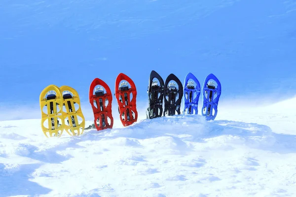 Snowshoes Stand Snow Backdrop Mountains — Stock Photo, Image