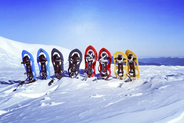 Snowshoes Stand Snow Backdrop Mountains — Stock Photo, Image