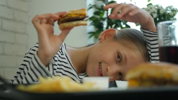 Child Eating Hamburger Restaurant Kid Eats Junk Fast Food Hungry — Stock Video