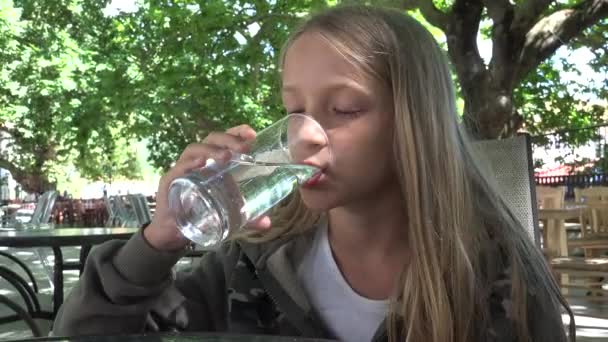 Child Drinking Water Restaurant Kid Holding Glass Water Girl Smiling — Stock Video