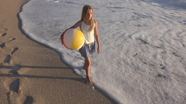 Child Playing on Beach at Sunset, Happy Kid Walking in Sea Waves Girl on Seaside — Stock Photo, Image