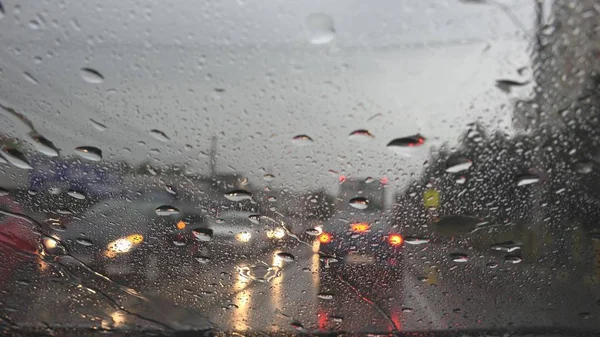 Traffic in Rain in City, Driving Car, Heavy Storm on Road, Highway, Rainy Drops