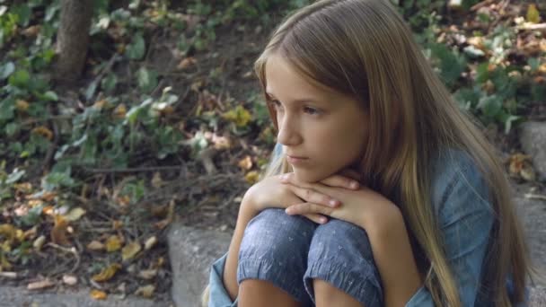 Sad Child, Not Playing Alone Kid, Unhappy Thoughtful Girl in Outdoor in Park — Stock Video