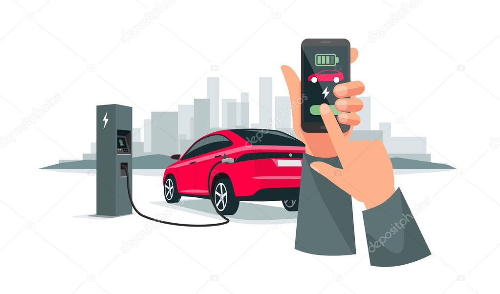 Hands Holding Smartphone with Charging App and Electric Car Recharging Batteries 