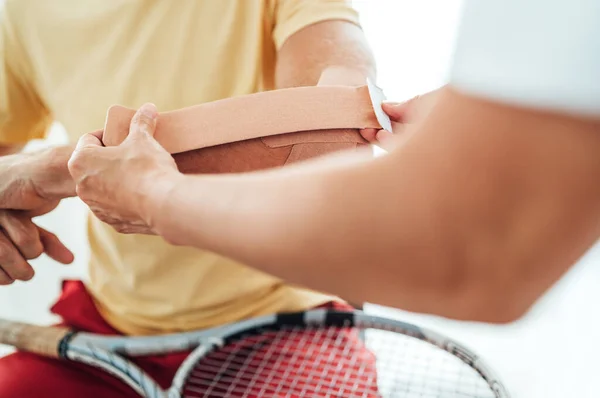 Tennis Player Elbow Taped Elastic Therapeutic Kinesio Tape Applied Nurse — Stock Photo, Image