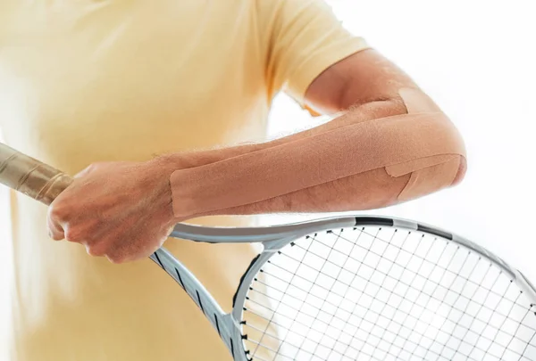 Tennis Player Elbow Taped Elastic Therapeutic Kinesio Tape Applied Arm — Stock Photo, Image