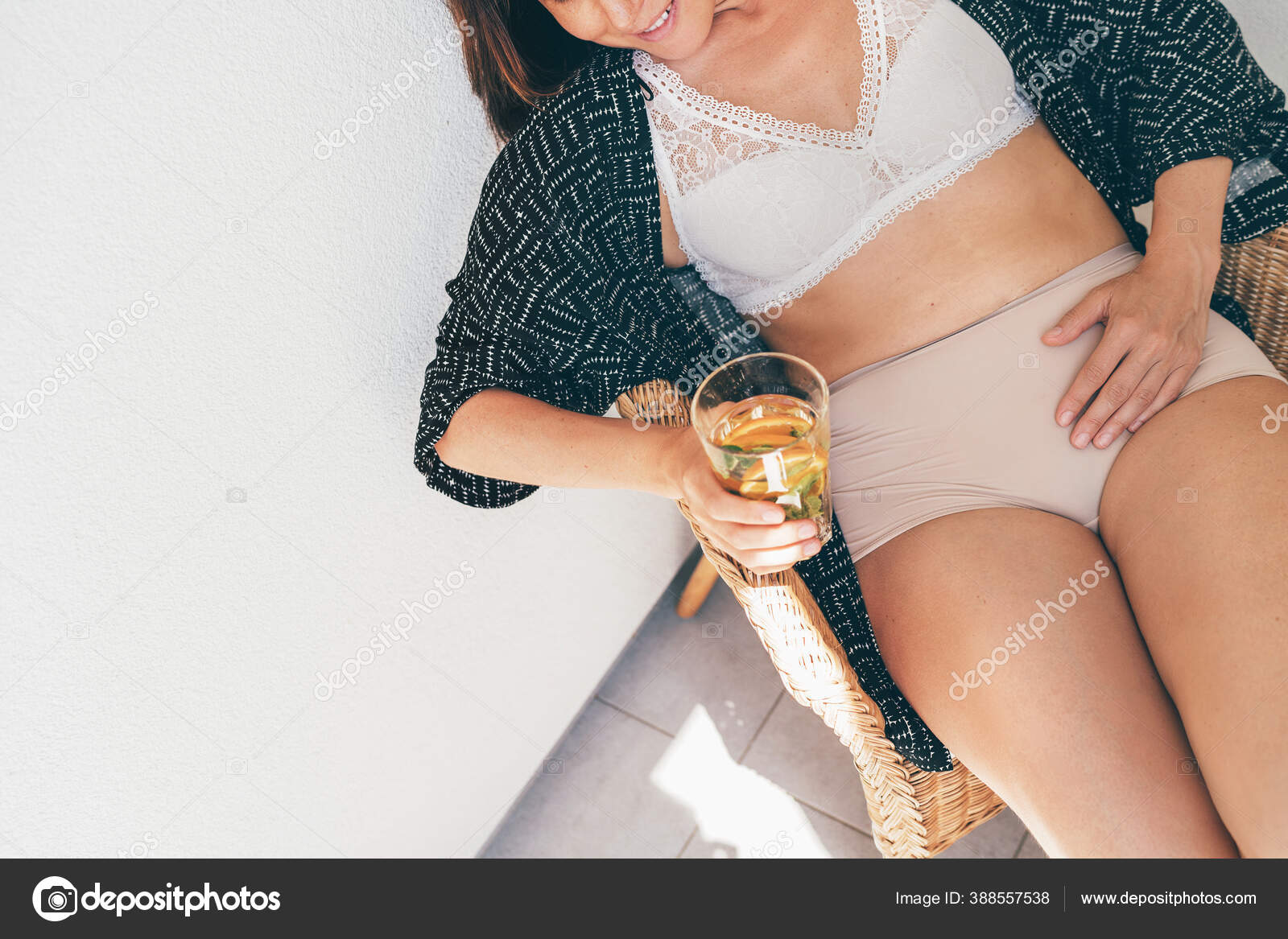 Beautiful Woman Sitting Wearing Lingerie Bra and Panties Stock