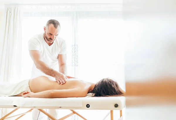 Bearded Masseur Man Doing Massage Manipulations Lumbar Area Zone Young — Stock Photo, Image