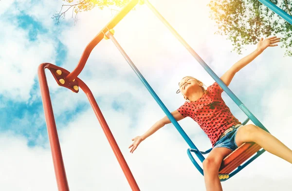 Happy Smiling Little Girl Swinging Swing Wide Opened Arms Blue — Stock Photo, Image