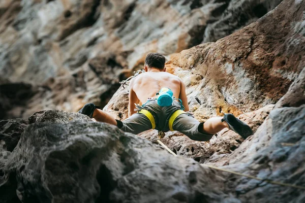 Mountain climber training on climbing route