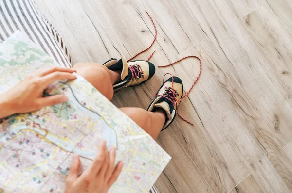 Young Female Inspecting City Map Resting Bed Untied Trekking Boots — Stock Photo, Image