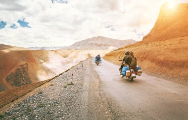 Motorcycle travelers ride in indian Himalaya roads clipart