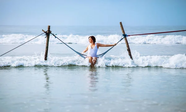 Woman White Swimsuit Sits Hammock Swing Ocean Surf Line — Stock Photo, Image