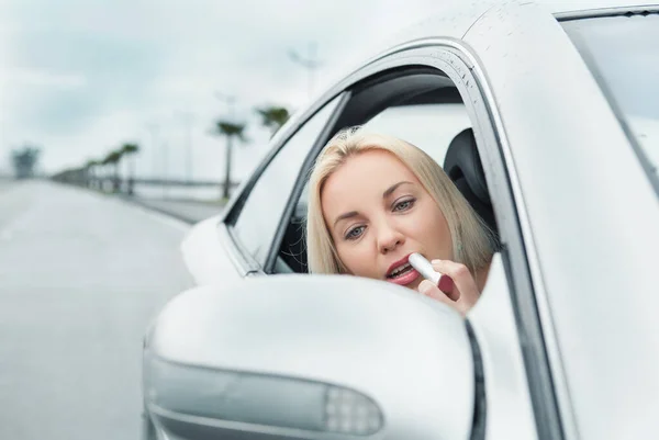Woman Apply Rose Lipstick Looking Car Mirror — Stock Photo, Image