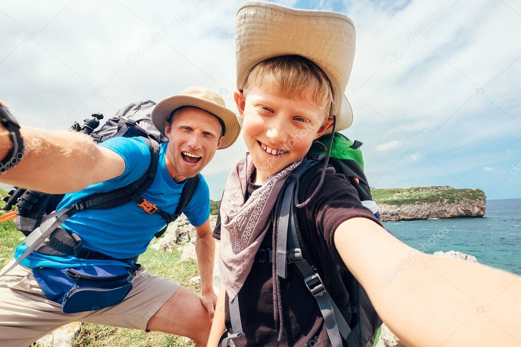 Father and son take their active vacation selfie photo