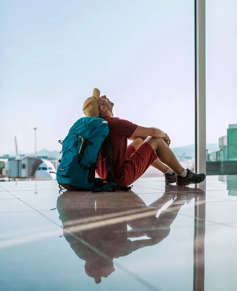 Alone Backpacker Traveler Sitting Airport Terminal Floor Window Looking Hall — Stock Photo, Image