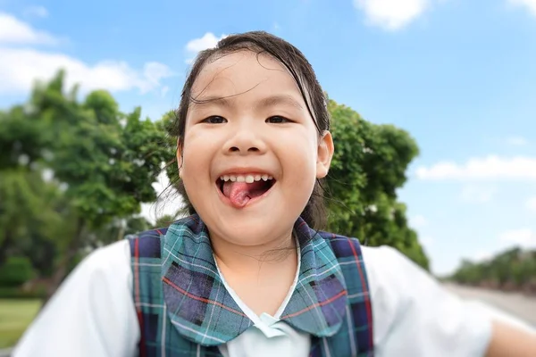 Adorable Asian Little Girl Standing Sunroof Car Cloud Tree Blue — стоковое фото