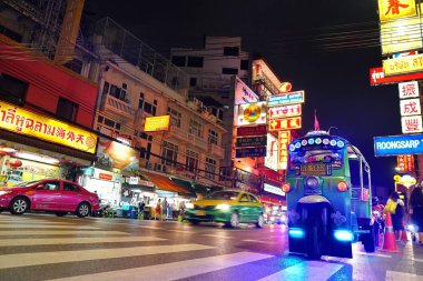 Bangkok,Thailand - Sep 12 - 2018: Tuk-Tuk on Yaowarat road at night,the main street of Chinatown in Bangkok.Tuk-Tuk is the name of Thai traditional taxi.Chinatown is famous landmark in Bangkok.        clipart