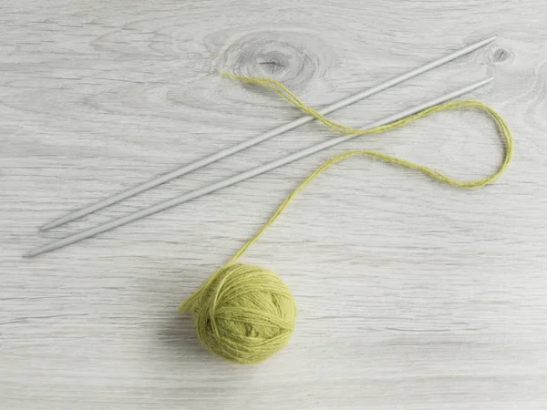 All for needlework: tangle of thread, knitting needles on a wooden gray table. ?op view. Copy space — Stock Photo, Image