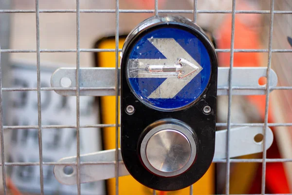 Sydney traffic light button, Traffic light pedestrian crossing buttons hangs on metal construction net