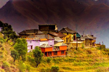 Small colorfull village tucked away in Himalayas clipart