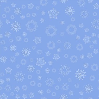 Mavi zemin üzerinde kusursuz kar taneleri deseni