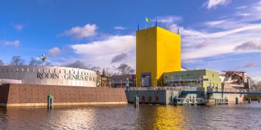 GRONINGEN, NETHERLANDS, MARCH 17, 2017: Groningen Museum postmodern achitecture wide angle panorama on sunny spring day clipart