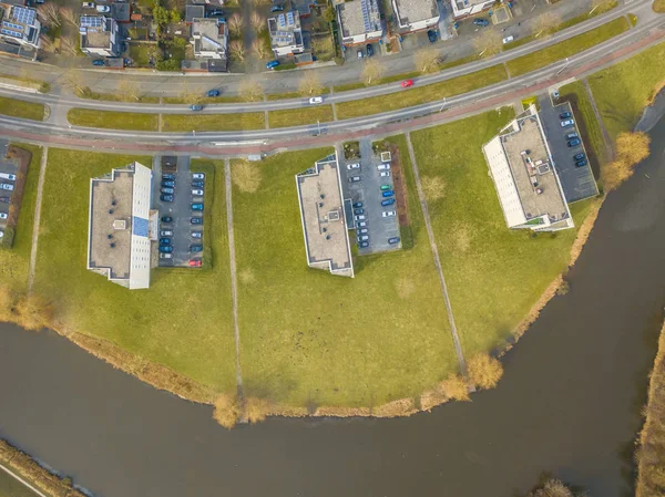 Top down view of apartment buildings with parking lots and lawns, de Held in city of Groningen