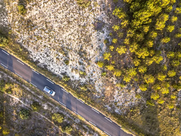 Car driving Road through barren landscape — Stock Photo, Image