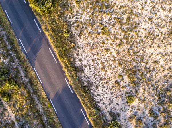 Road through barren landscape