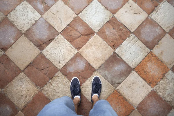 Top View Man Standing Aged Rocky Tiles Floor Personal Perspective — Stock Photo, Image