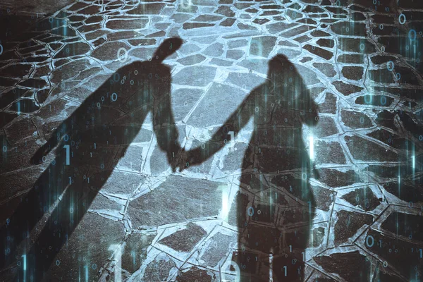 Shadow of two people holding hands together with artistic computer cyberspace binary numbers data background.