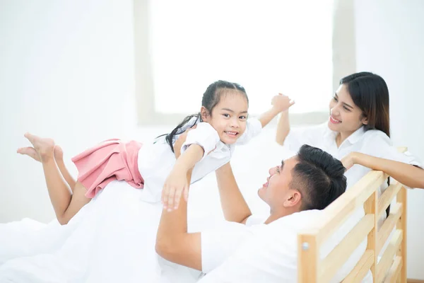 A happy asia family with kids in the living, Happy family mother, Father, Child daughter at home, Happy loving family, Father and his daughter child girl playing together